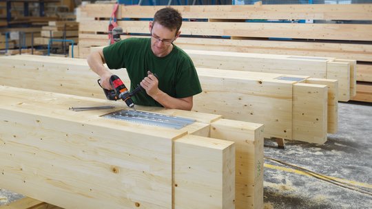 Bolting the steel parts together by hand