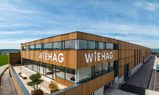 Rendering der neuen Produktionshalle mit Bürogebäude